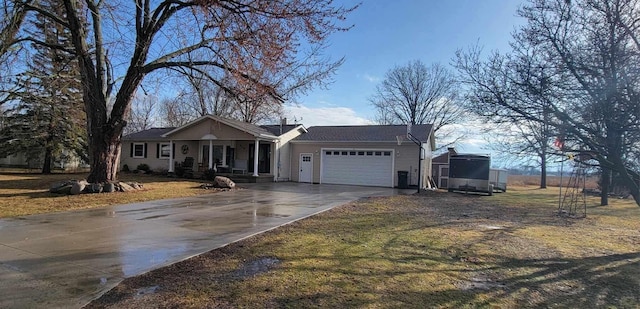 single story home featuring a garage and concrete driveway