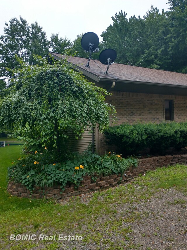 view of property exterior featuring brick siding