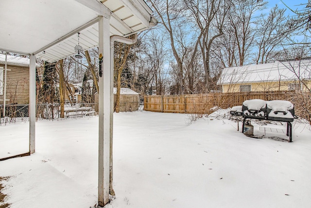 view of yard layered in snow