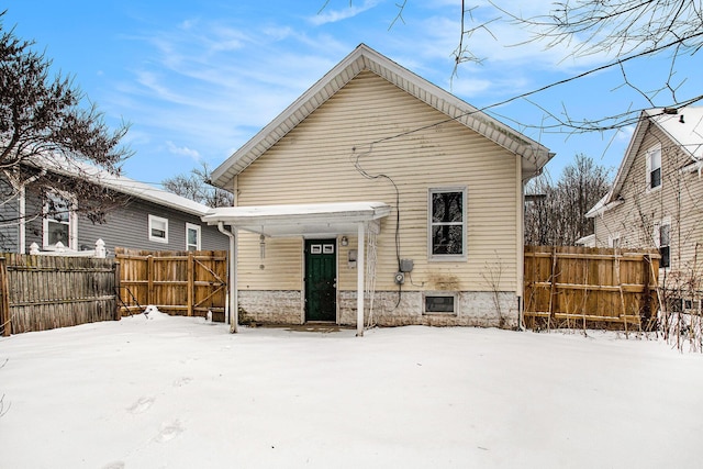 view of snow covered house