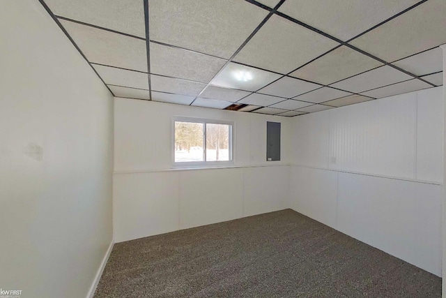 basement with a drop ceiling and carpet floors