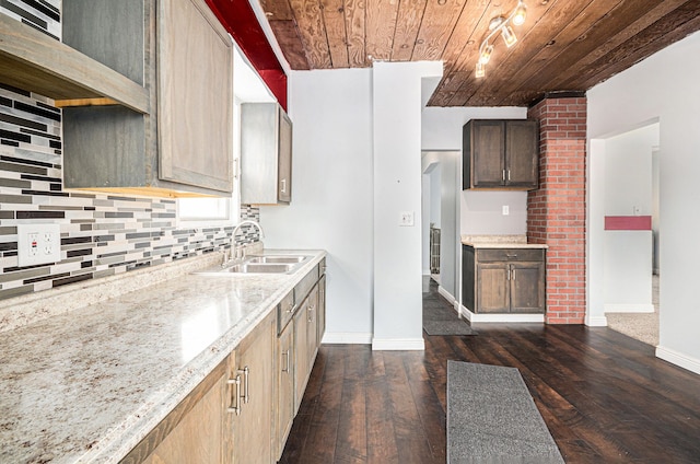 kitchen with decorative backsplash, wooden ceiling, light stone counters, dark wood-style flooring, and a sink