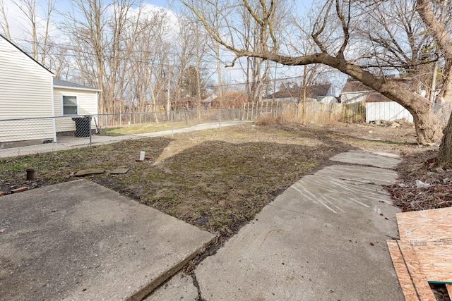 view of yard featuring fence and a patio