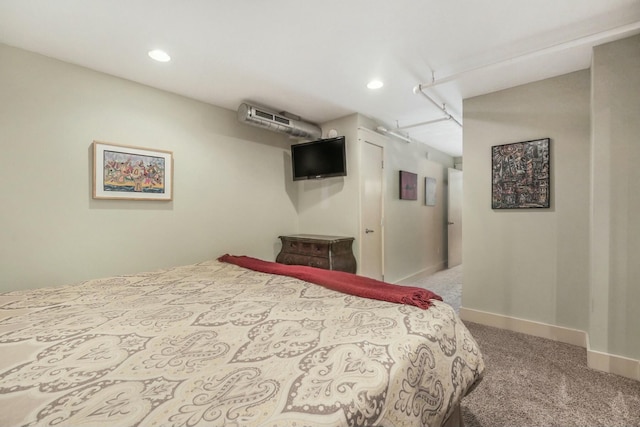 carpeted bedroom with a wall mounted air conditioner