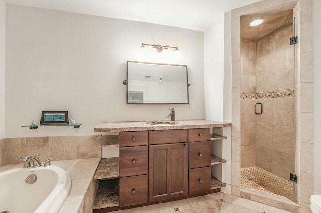 bathroom with tile patterned floors, separate shower and tub, and vanity