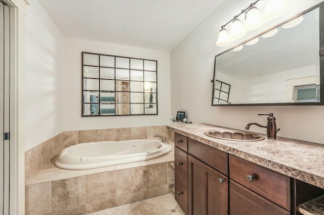 bathroom with tiled bath, tile patterned floors, and vanity