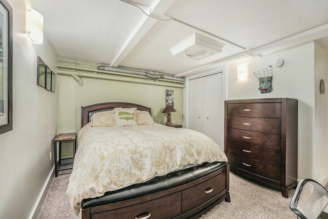 carpeted bedroom with a closet