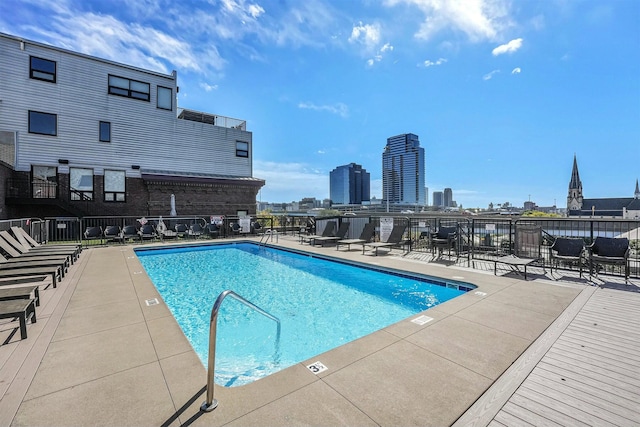 view of pool featuring a patio