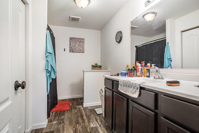 bathroom with wood-type flooring and vanity