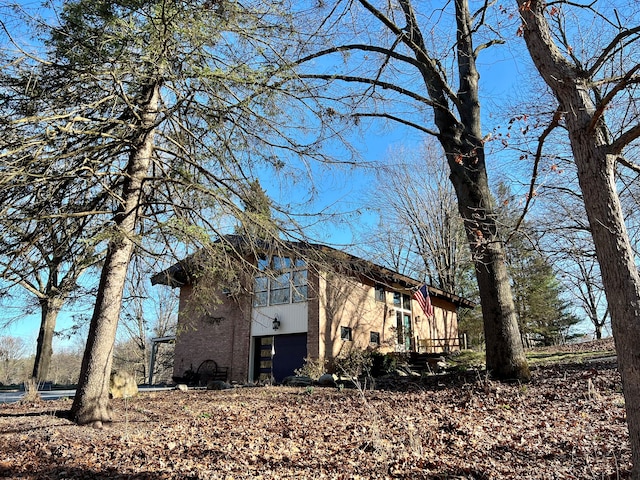 view of side of home with a garage