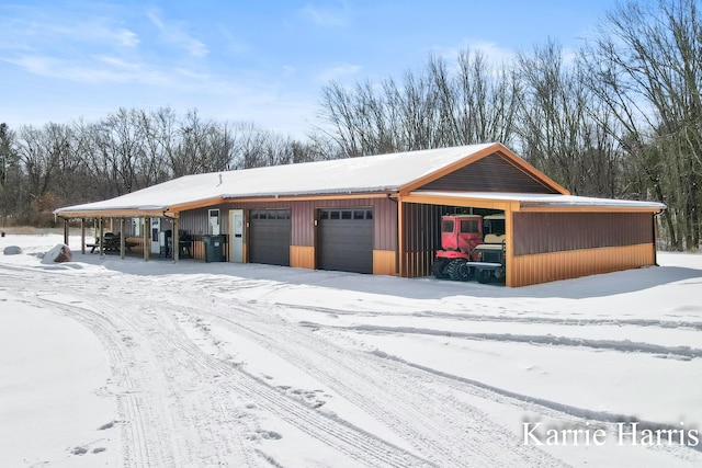 view of snow covered garage