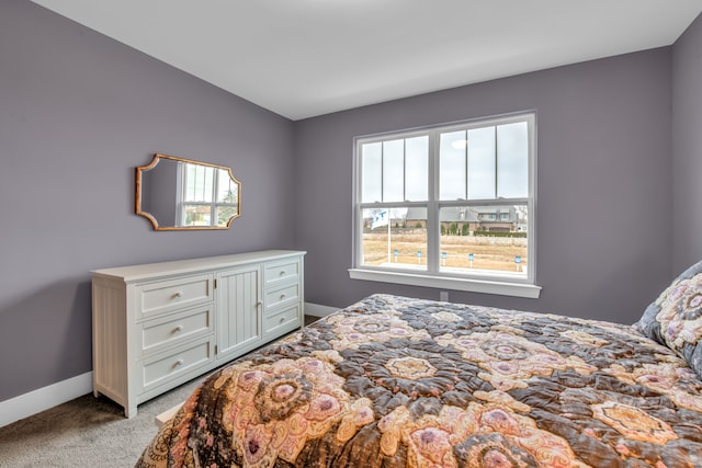 bedroom featuring light colored carpet