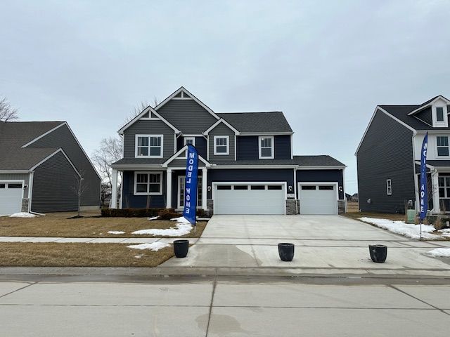 view of front facade featuring driveway and an attached garage
