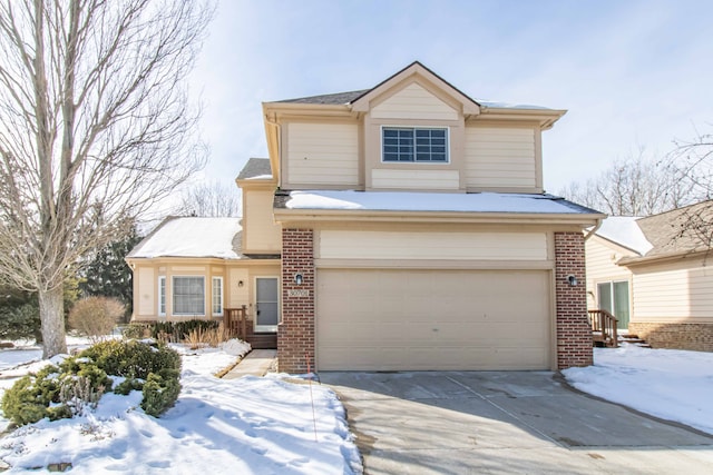 traditional-style home featuring concrete driveway, brick siding, and an attached garage