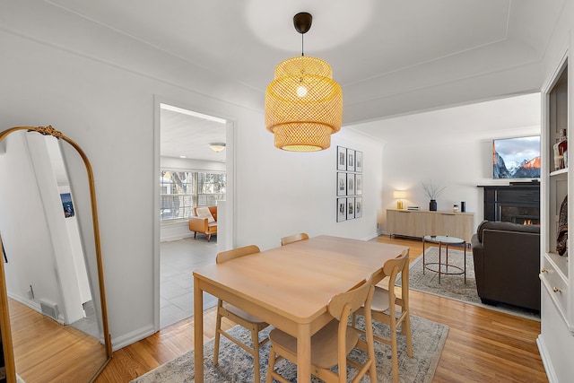 dining space with light wood-type flooring