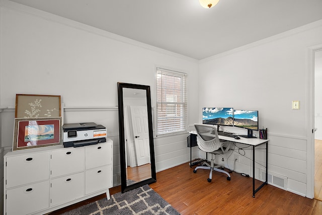 office area with hardwood / wood-style flooring and ornamental molding