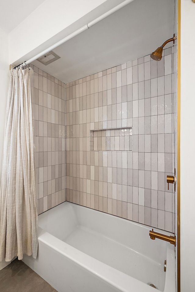 bathroom featuring shower / bathtub combination with curtain