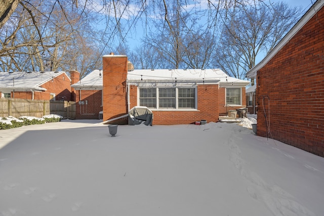 view of snow covered house