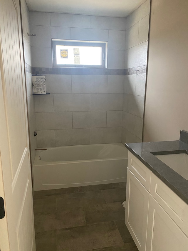 full bathroom featuring tub / shower combination and vanity