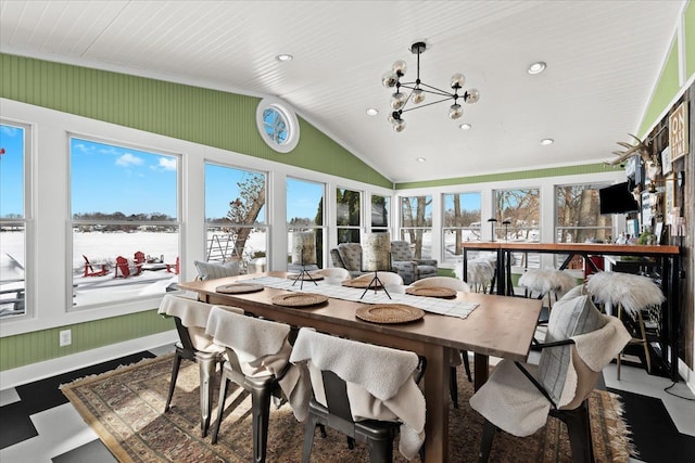 sunroom / solarium featuring lofted ceiling and a notable chandelier