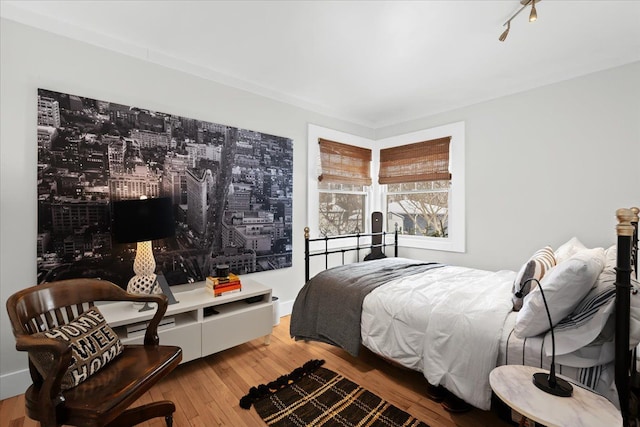 bedroom featuring hardwood / wood-style floors