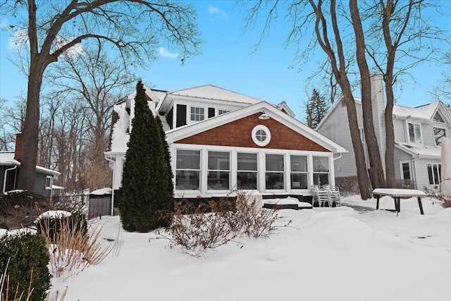 exterior space featuring a sunroom