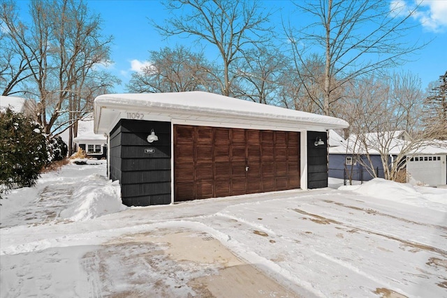 view of snow covered garage