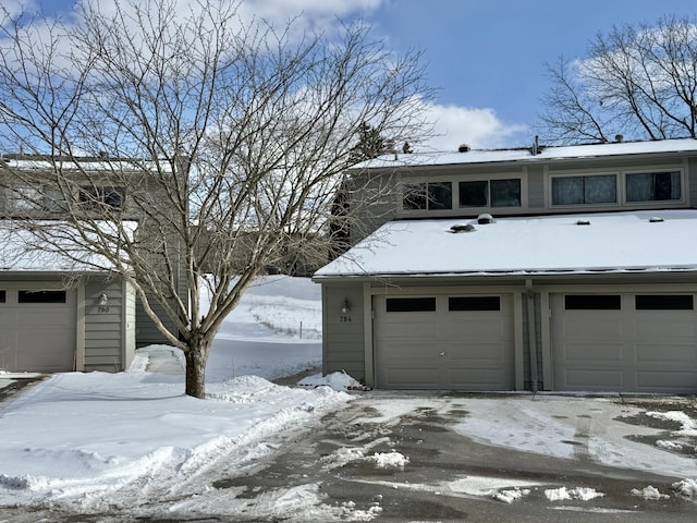 view of snow covered garage