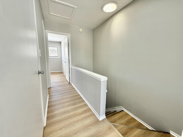 corridor with light hardwood / wood-style flooring