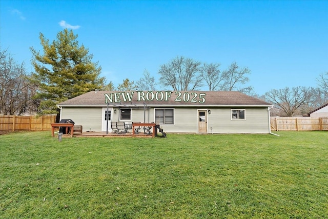 back of house with a yard