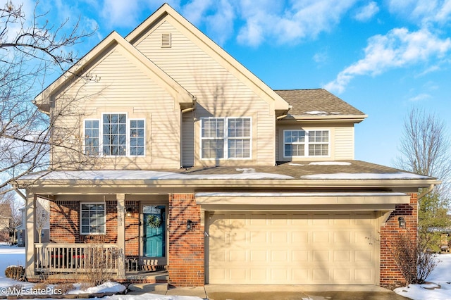 front facade featuring covered porch and a garage