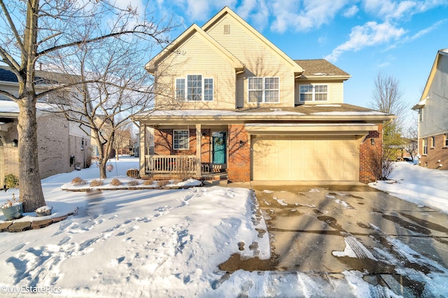 view of property featuring covered porch and a garage