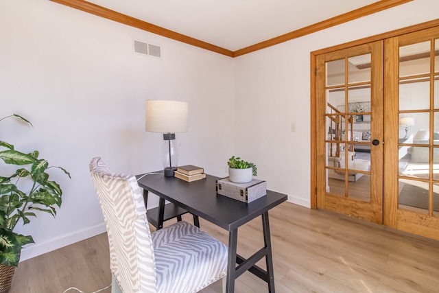 office area featuring visible vents, crown molding, baseboards, light wood-style flooring, and french doors