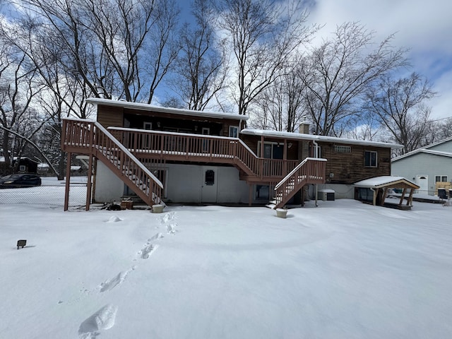 view of front of property with a wooden deck and cooling unit