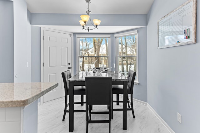 dining area featuring a chandelier