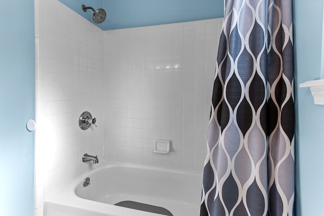 bathroom with shower / bath combination with curtain