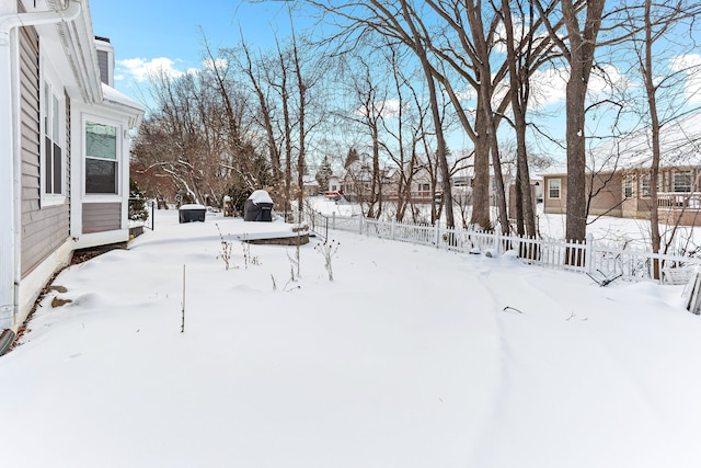 view of yard covered in snow