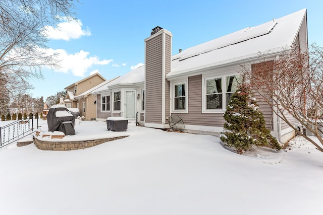 view of snow covered house