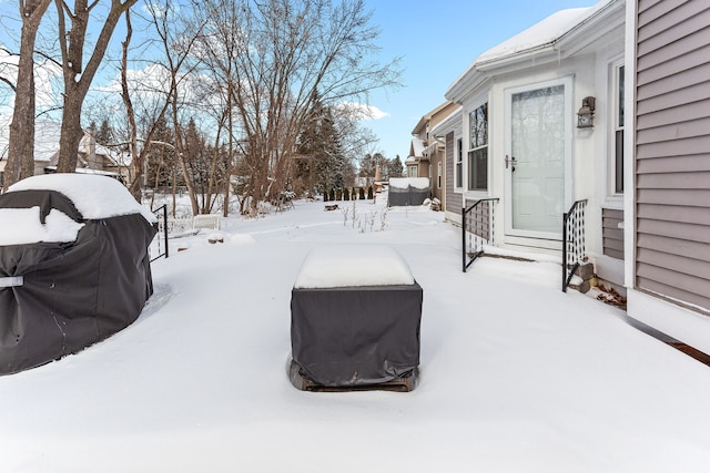 view of yard layered in snow