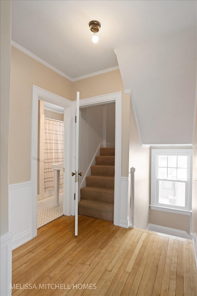 interior space with hardwood / wood-style flooring and crown molding