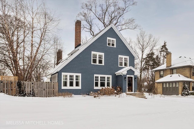 view of snow covered house