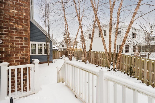 view of yard layered in snow