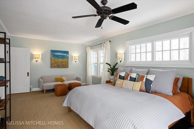 carpeted bedroom featuring ceiling fan and crown molding