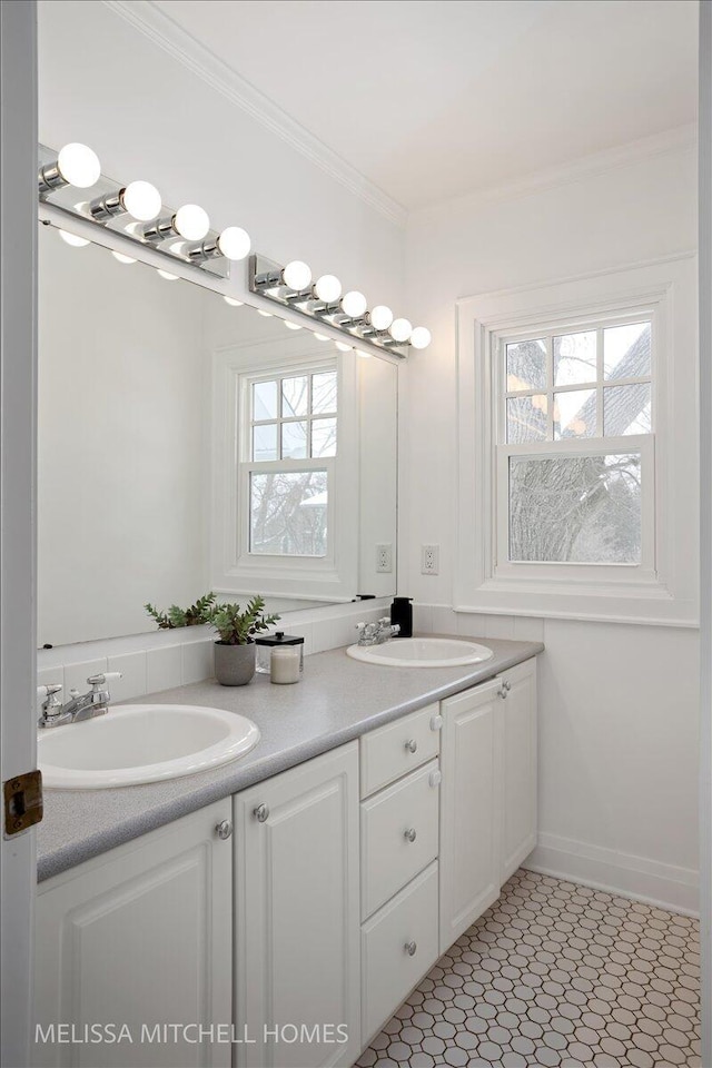 bathroom featuring vanity and ornamental molding