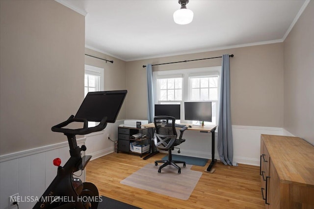 home office featuring light hardwood / wood-style flooring and ornamental molding