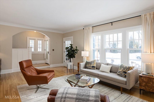 living room featuring hardwood / wood-style floors and crown molding