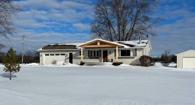 view of front of property with a garage and a porch