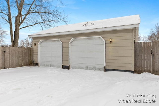 view of snow covered garage