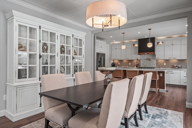 dining room with an inviting chandelier, dark wood finished floors, crown molding, and recessed lighting