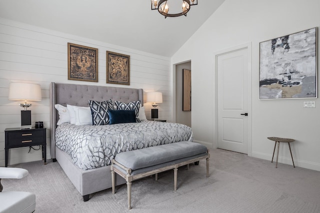 bedroom with a chandelier, light carpet, vaulted ceiling, and baseboards